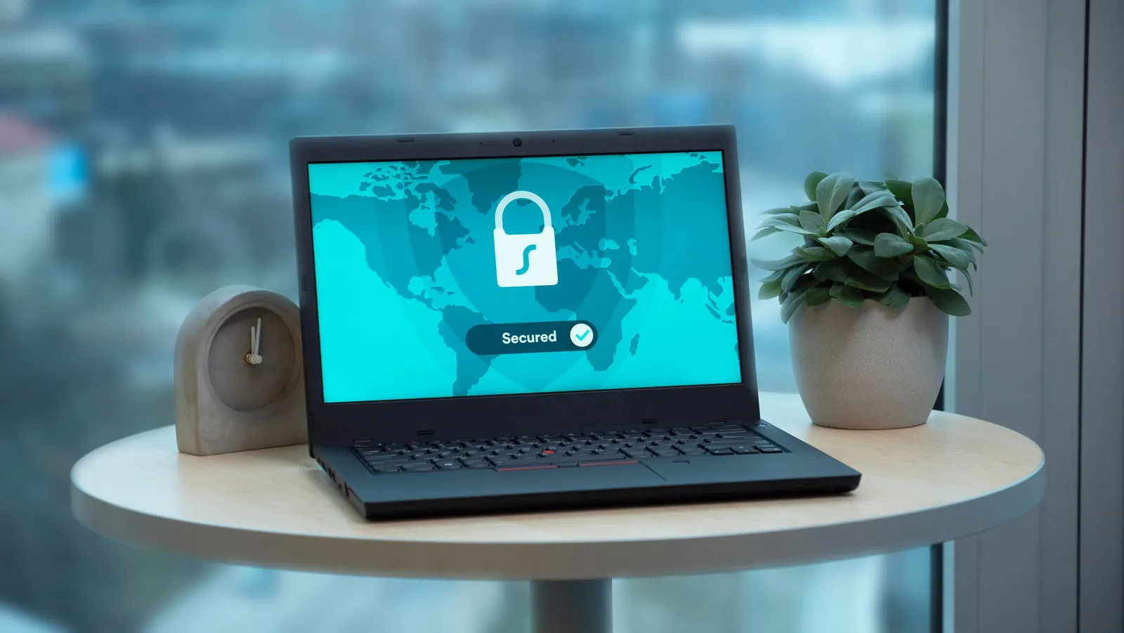 Laptop screen showing a secure lock graphic for digital security.